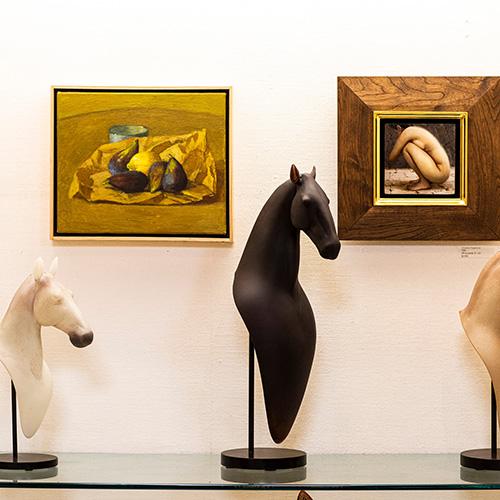 art on walls and horse sculptures