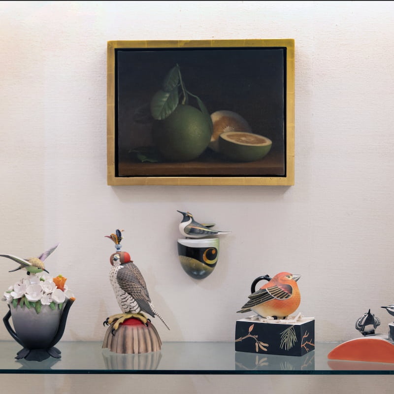 bird sculptures and painting of fruit